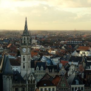 Preview wallpaper tower, clock, buildings, architecture, city, sunrise