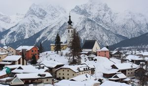 Preview wallpaper tower, clock, snow, buildings, mountain