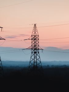 Preview wallpaper tower, construction, silhouette, forest, twilight, dark