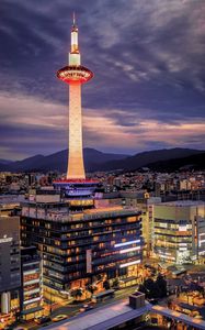 Preview wallpaper tower, glow, lights, buildings, twilight, city
