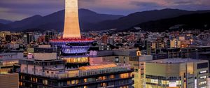 Preview wallpaper tower, glow, lights, buildings, twilight, city