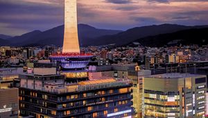 Preview wallpaper tower, glow, lights, buildings, twilight, city