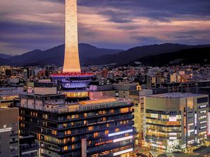 Preview wallpaper tower, glow, lights, buildings, twilight, city