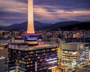 Preview wallpaper tower, glow, lights, buildings, twilight, city