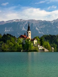 Preview wallpaper tower, house, mountains, trees, lake