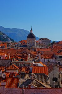 Preview wallpaper tower, houses, roofs, tiles, city