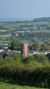 Preview wallpaper tower, houses, trees, village