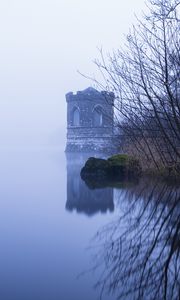 Preview wallpaper tower, lake, reflection, tree, branches, fog