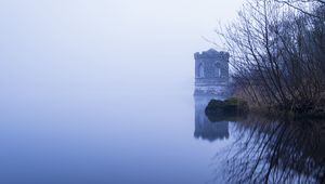 Preview wallpaper tower, lake, reflection, tree, branches, fog