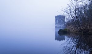 Preview wallpaper tower, lake, reflection, tree, branches, fog