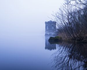 Preview wallpaper tower, lake, reflection, tree, branches, fog