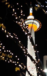 Preview wallpaper tower, lights, bokeh, branches, dark
