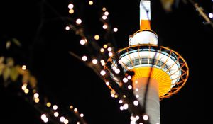 Preview wallpaper tower, lights, bokeh, branches, dark