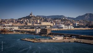 Preview wallpaper tower, mountain, buildings, city, sea, pier