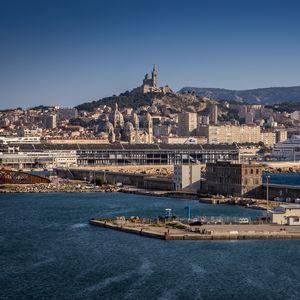 Preview wallpaper tower, mountain, buildings, city, sea, pier