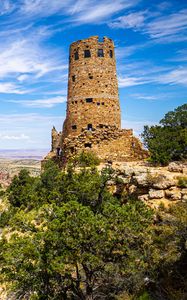 Preview wallpaper tower, mountains, rocks, clouds, nature
