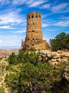Preview wallpaper tower, mountains, rocks, clouds, nature