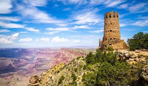 Preview wallpaper tower, mountains, rocks, clouds, nature