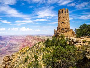 Preview wallpaper tower, mountains, rocks, clouds, nature
