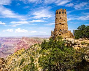 Preview wallpaper tower, mountains, rocks, clouds, nature
