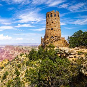 Preview wallpaper tower, mountains, rocks, clouds, nature