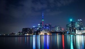 Preview wallpaper tower, night city, architecture, lights, reflection