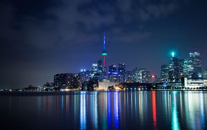 Preview wallpaper tower, night city, architecture, lights, reflection