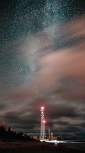 Preview wallpaper tower, night, starry sky, stars, glow