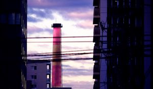 Preview wallpaper tower, pipe, buildings, wires, dark