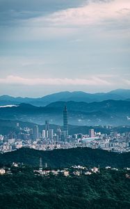 Preview wallpaper tower, skyscraper, city, mountains, hills