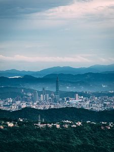 Preview wallpaper tower, skyscraper, city, mountains, hills