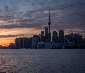 Preview wallpaper tower, skyscrapers, buildings, city, sea, sunrise