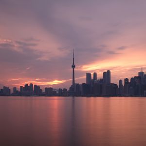 Preview wallpaper tower, skyscrapers, buildings, sea, city, twilight