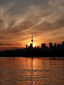 Preview wallpaper tower, skyscrapers, buildings, silhouettes, sea, twilight