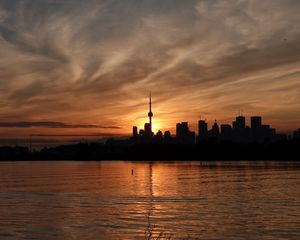 Preview wallpaper tower, skyscrapers, buildings, silhouettes, sea, twilight