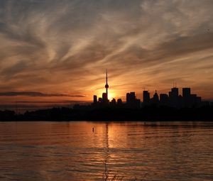 Preview wallpaper tower, skyscrapers, buildings, silhouettes, sea, twilight