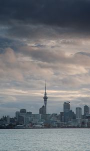 Preview wallpaper tower, skyscrapers, buildings, city, sea, clouds