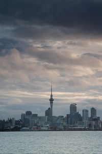 Preview wallpaper tower, skyscrapers, buildings, city, sea, clouds