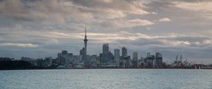 Preview wallpaper tower, skyscrapers, buildings, city, sea, clouds