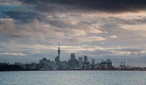 Preview wallpaper tower, skyscrapers, buildings, city, sea, clouds