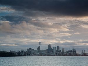 Preview wallpaper tower, skyscrapers, buildings, city, sea, clouds