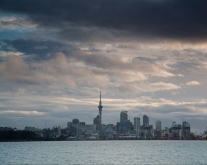 Preview wallpaper tower, skyscrapers, buildings, city, sea, clouds