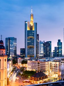 Preview wallpaper tower, skyscrapers, buildings, lights, city, twilight