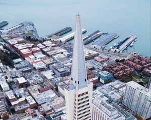 Preview wallpaper tower, skyscrapers, buildings, pier, sea