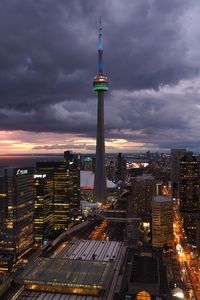 Preview wallpaper tower, skyscrapers, buildings, lights, city, twilight, clouds