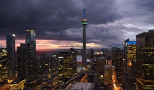 Preview wallpaper tower, skyscrapers, buildings, lights, city, twilight, clouds