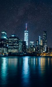 Preview wallpaper tower, skyscrapers, lights, night, river, starry sky