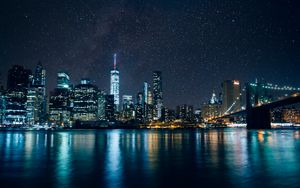 Preview wallpaper tower, skyscrapers, lights, night, river, starry sky