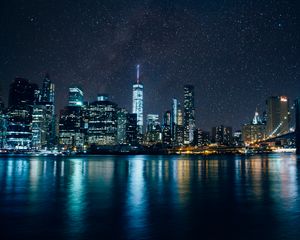Preview wallpaper tower, skyscrapers, lights, night, river, starry sky