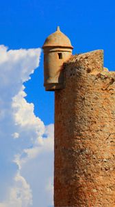 Preview wallpaper tower, wall, building, architecture, sky, clouds